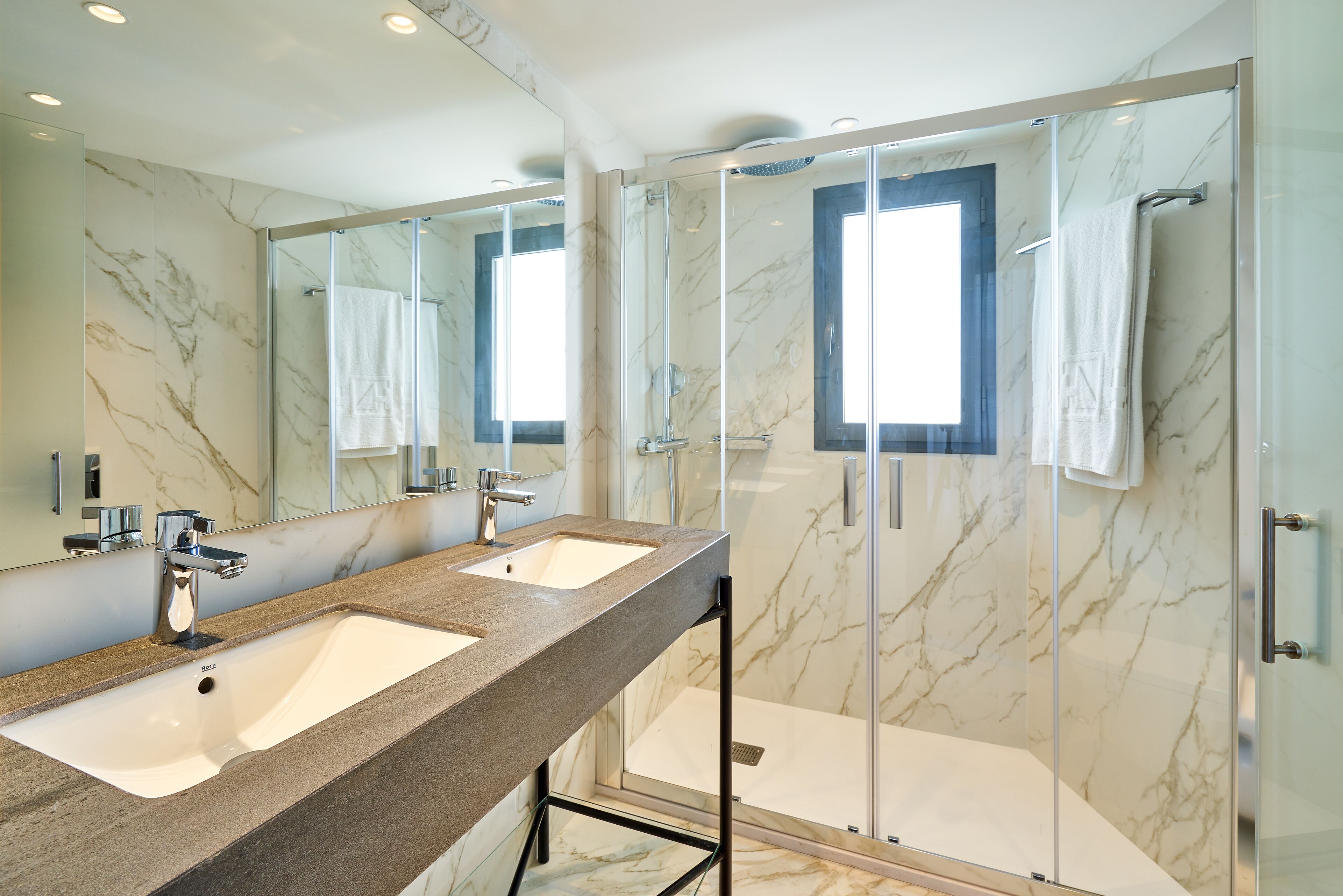 Shower, eco-friendly toiletries, hair dryer, towels