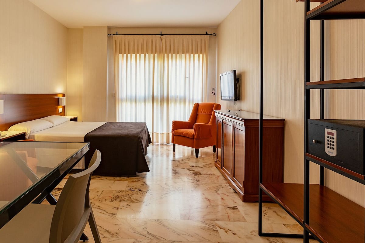 Studio, 1 Bedroom (2 Adults) | 1 bedroom, in-room safe, desk, iron/ironing board