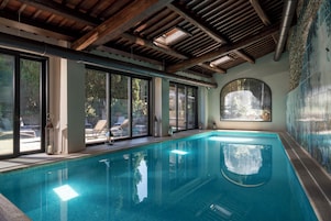 Indoor pool, seasonal outdoor pool, pool umbrellas, sun loungers