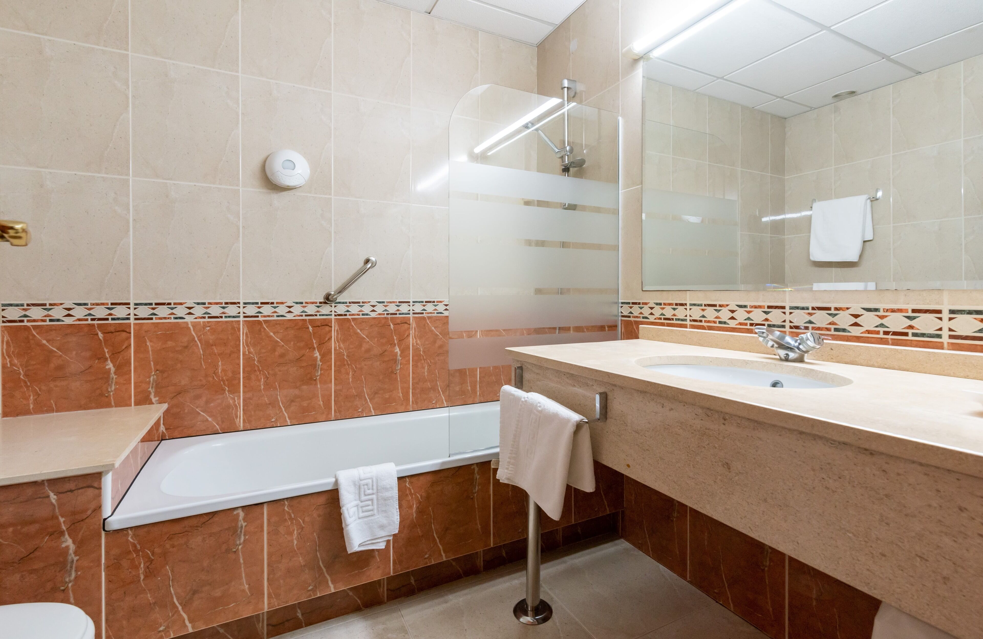 bathtub, hair dryer, towels