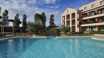 Seasonal outdoor pool, pool umbrellas, pool loungers