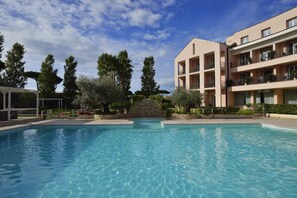 Seasonal outdoor pool, pool umbrellas, sun loungers