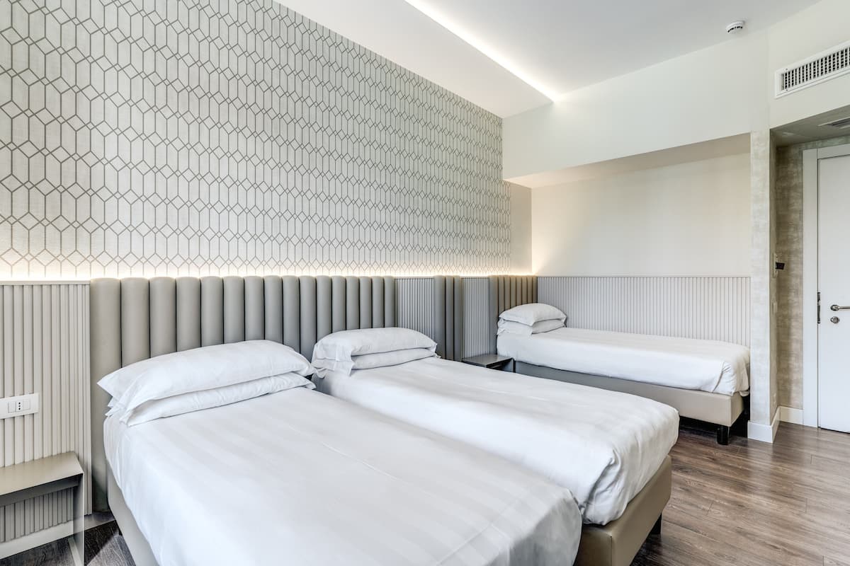 Superior Triple Room | Minibar, in-room safe, desk, soundproofing