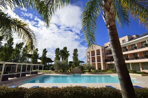 Seasonal outdoor pool, pool umbrellas, sun loungers