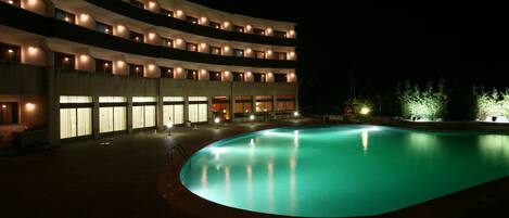 Seasonal outdoor pool, open 9:00 AM to 8:00 PM, pool umbrellas