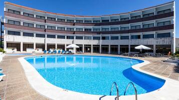 Seasonal outdoor pool, open 9:00 AM to 8:00 PM, pool umbrellas