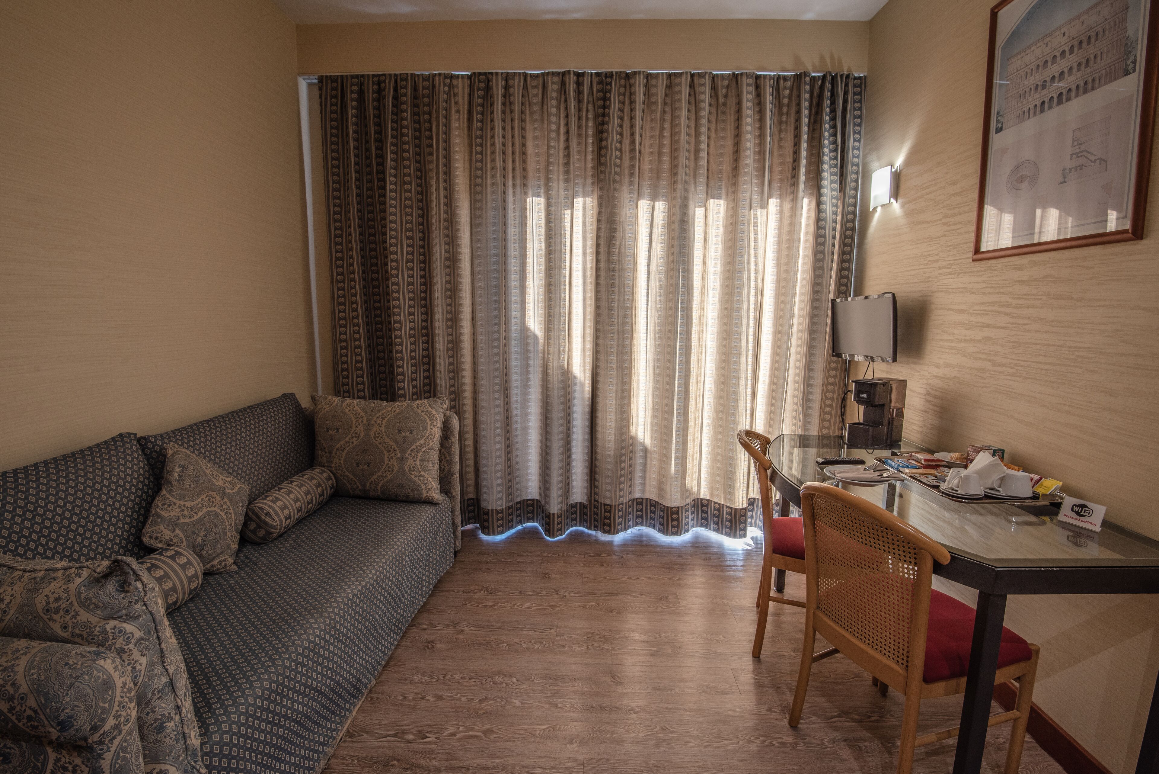 triple room | living area | flat-screen tv