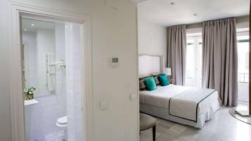 Shower, designer toiletries, hair dryer, towels