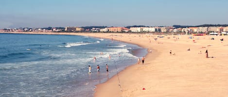 Beach nearby, white sand, beach towels