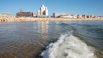 Beach nearby, white sand, beach towels