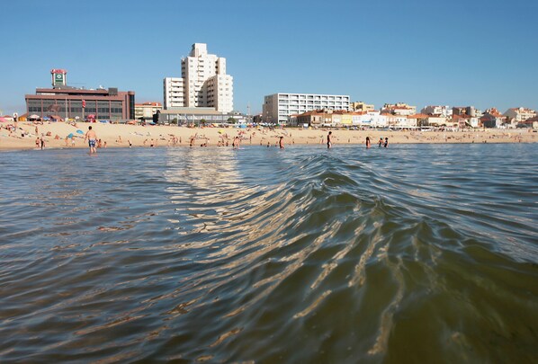 Beach nearby, white sand, beach towels