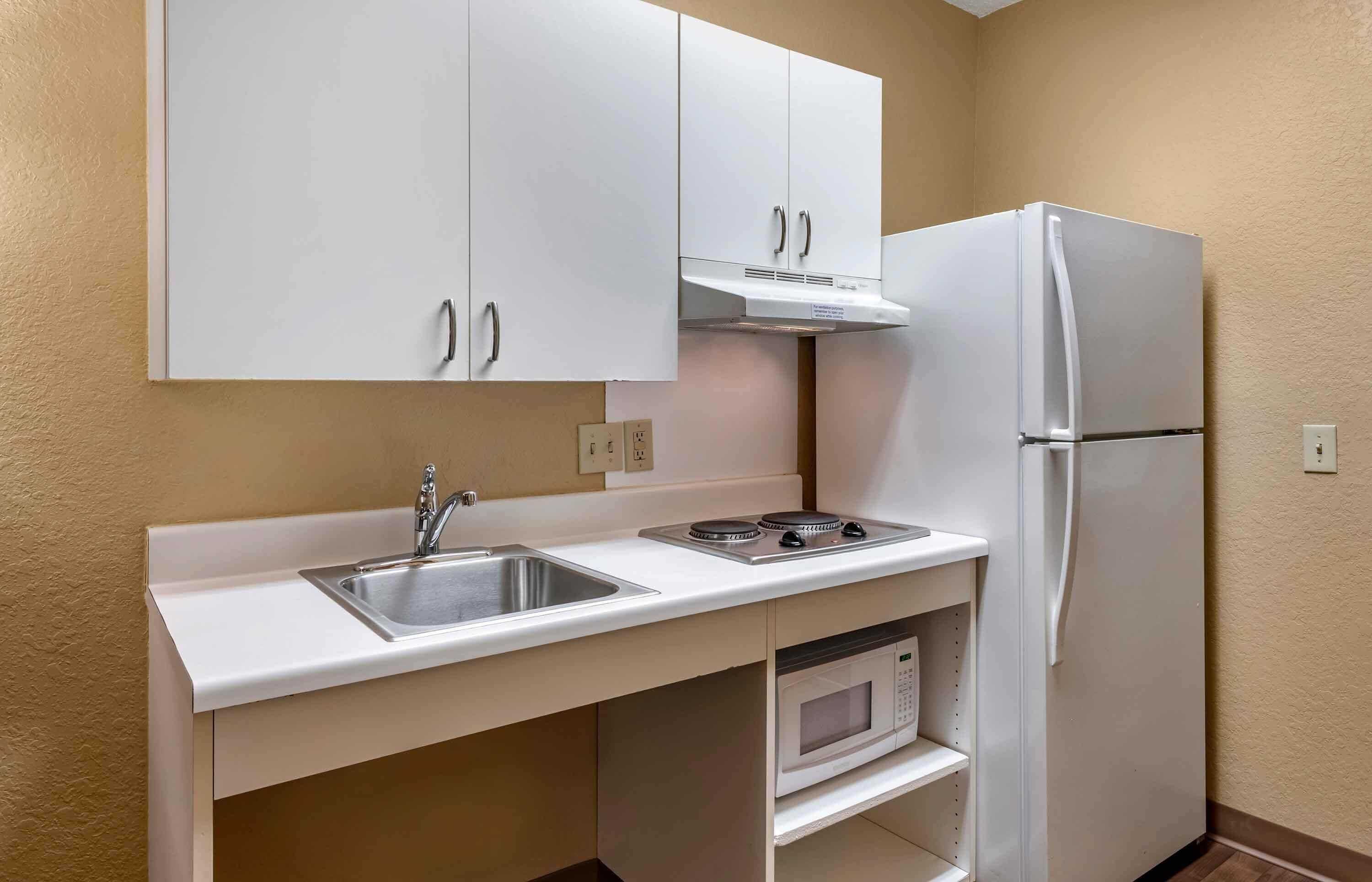 Studio, 1 Queen Bed, Roll-in Shower | Private kitchen | Coffee/tea maker, full-size fridge, microwave, stovetop