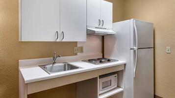 Studio, 1 Queen Bed, Roll-in Shower | Private kitchen | Coffee/tea maker, full-size fridge, microwave, stovetop