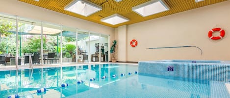 Indoor pool, open 8:00 AM to 9:00 PM, pool loungers