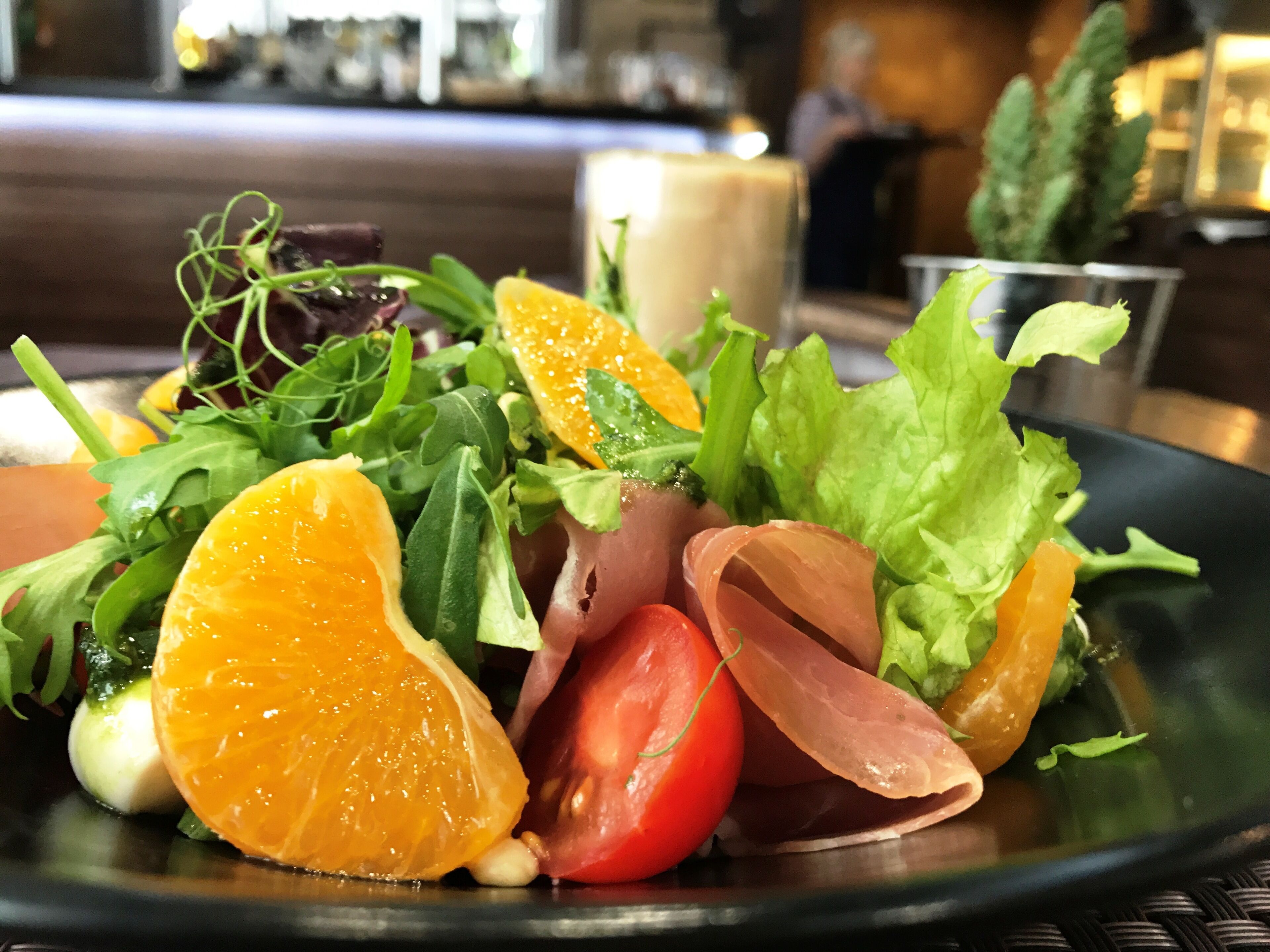 A plate of food with various vegetables and fruits.