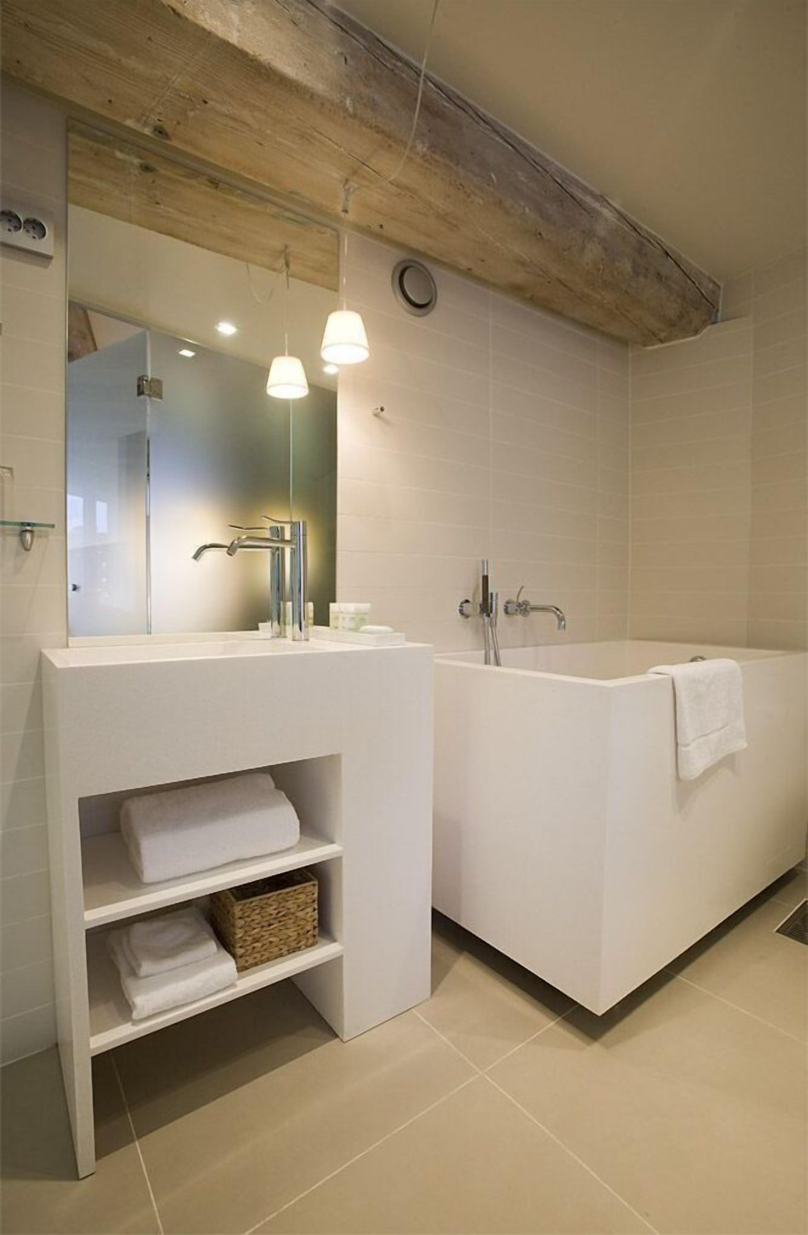 junior studio suite | bathroom | shower, hair dryer, towels