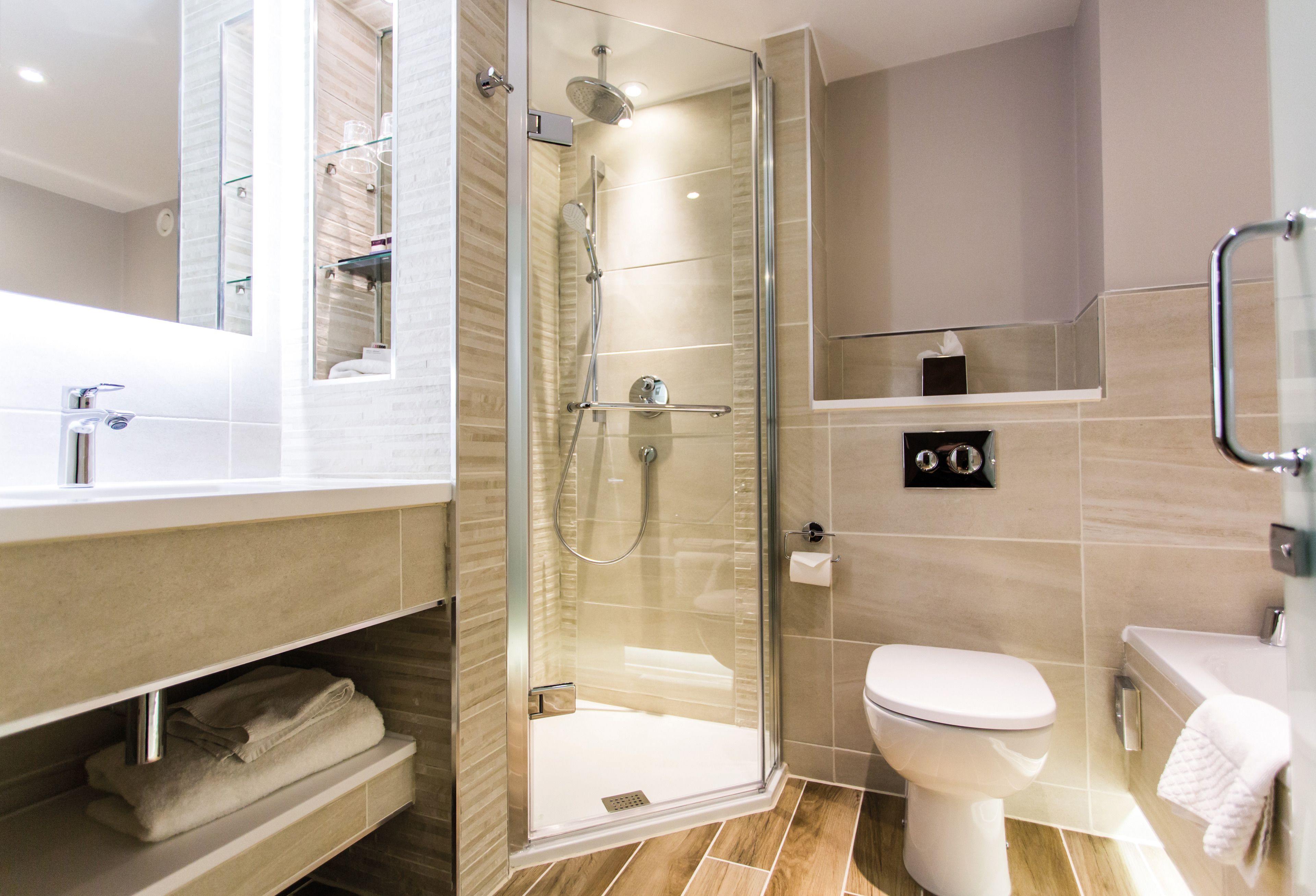 combined shower/bathtub, designer toiletries, hair dryer, bathrobes