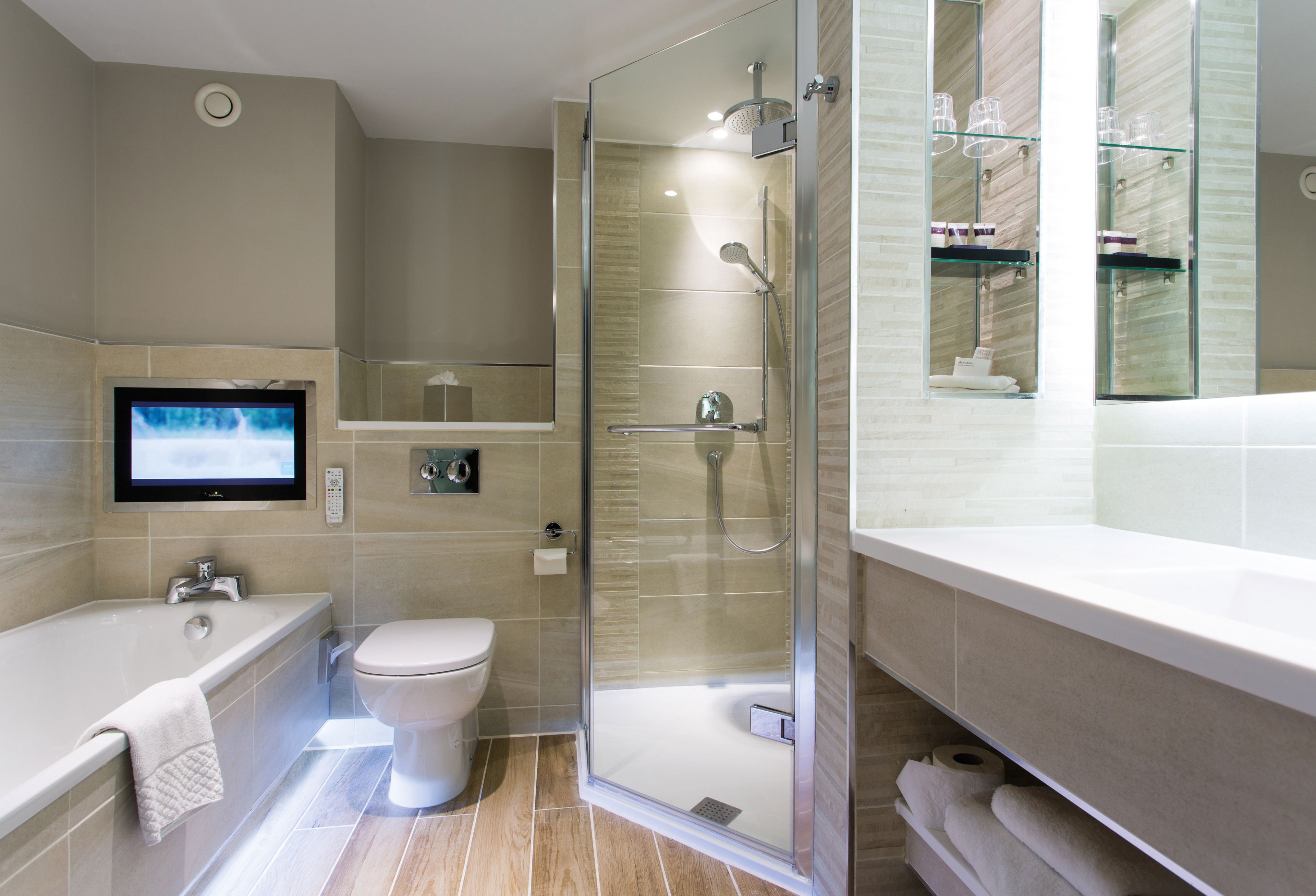 combined shower/bathtub, designer toiletries, hair dryer, bathrobes