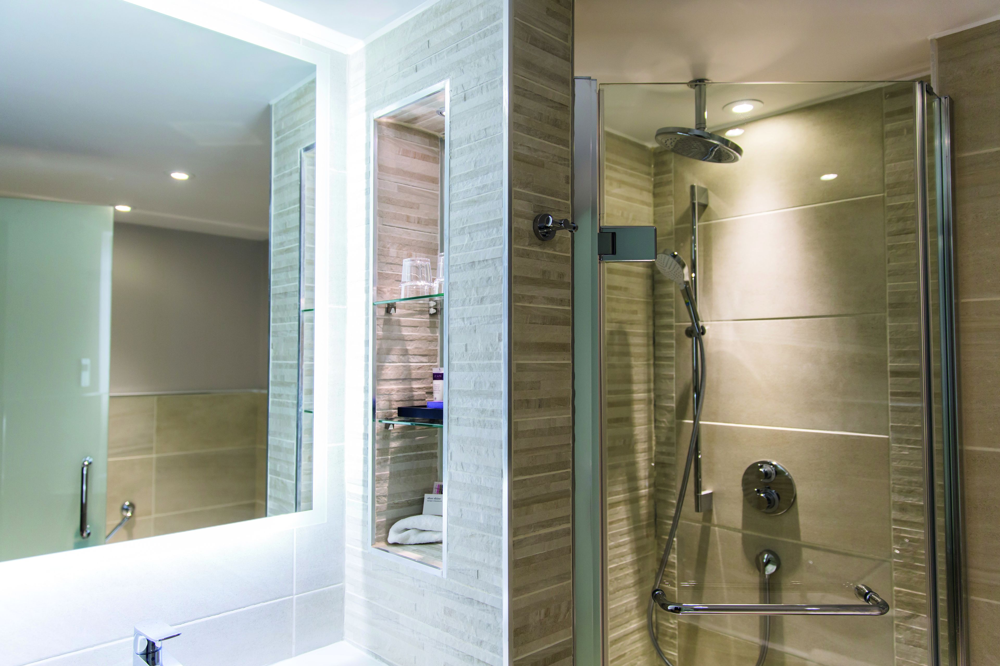 combined shower/bathtub, designer toiletries, hair dryer, bathrobes