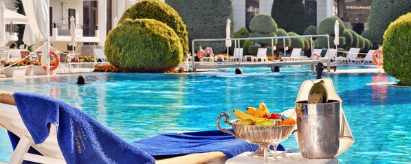 Seasonal outdoor pool, pool umbrellas, pool loungers