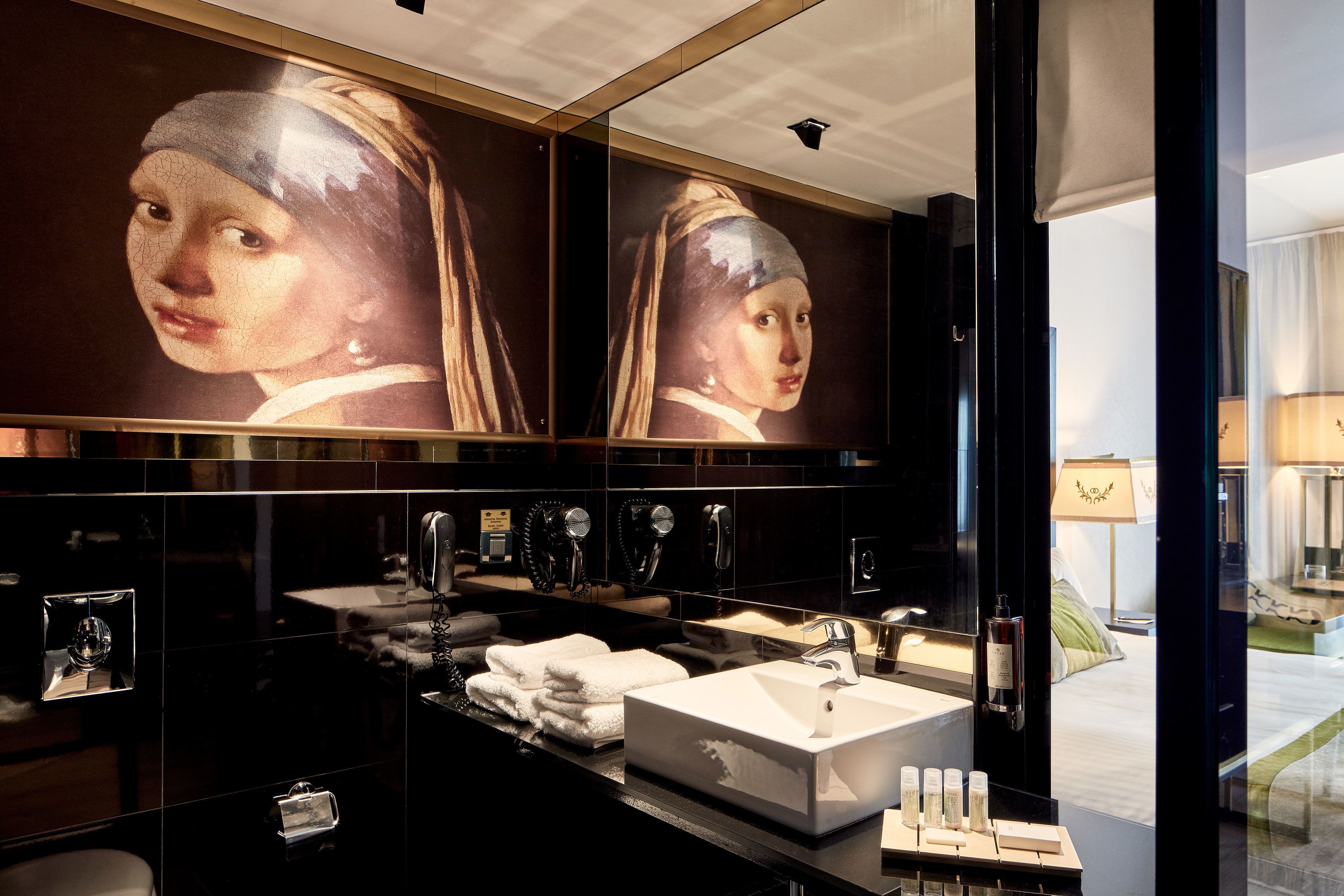 deep-soaking bathtub, designer toiletries, hair dryer, bathrobes