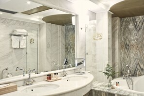 Deep soaking tub, designer toiletries, hair dryer, bathrobes