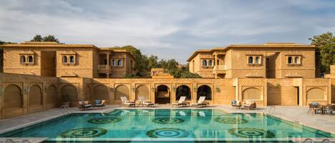 Outdoor pool, open 7:00 AM to 6:00 PM, free cabanas, pool umbrellas