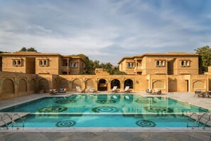 Outdoor pool, open 7:00 AM to 6:00 PM, free cabanas, pool umbrellas