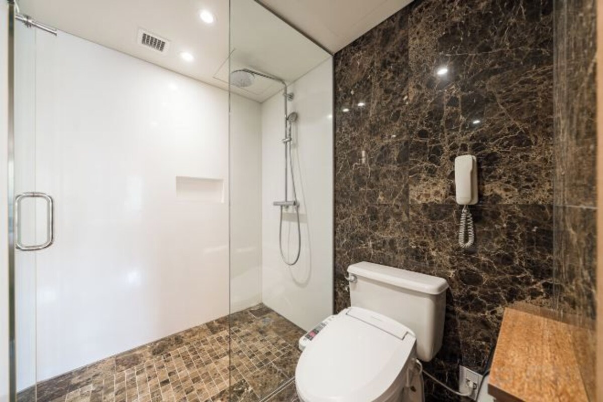 Bathroom | Hair dryer, slippers, towels