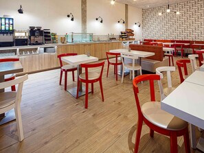 Enjoy a self-service dining experience with a variety of food and beverages at this modern restaurant.