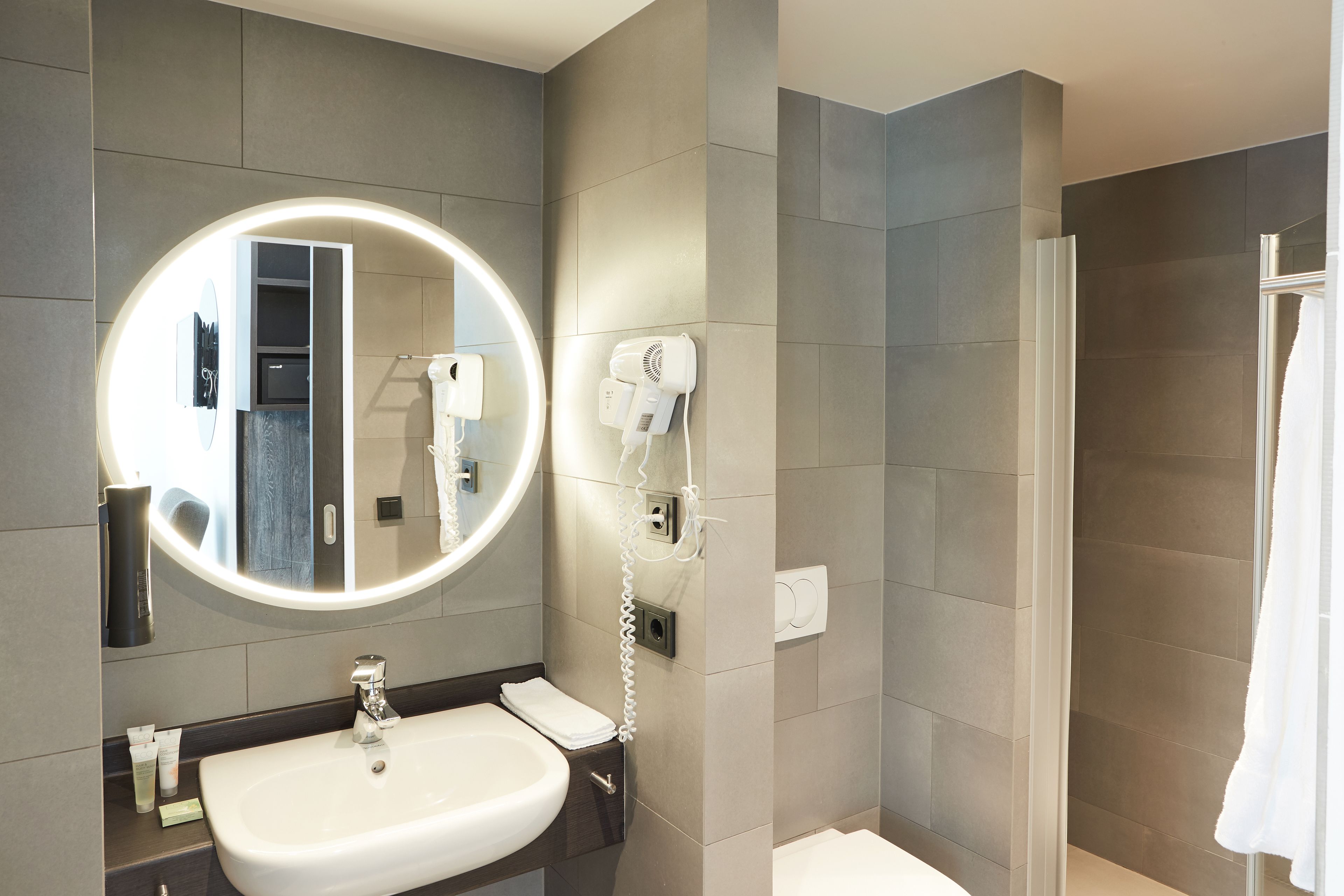 family room, connecting rooms (deluxe) | bathroom | hair dryer, towels