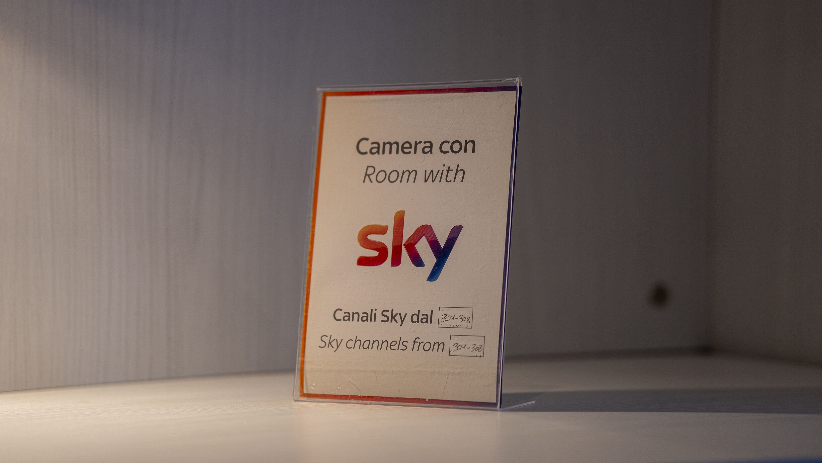 A sign indicating a room with Sky channels.