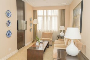 Suite, City View | Living area | 42-inch LCD TV with satellite channels