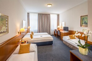 Standard Quadruple Room, City View | Hypo-allergenic bedding, in-room safe, desk, blackout drapes