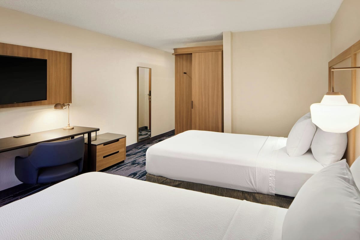 Hypo-allergenic bedding available, down comforters, in-room safe, desk