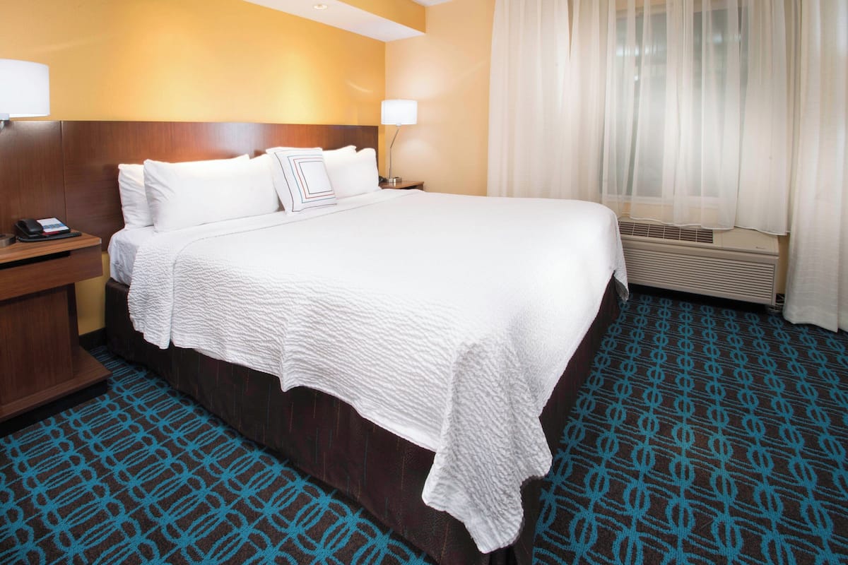room, 1 king bed with sofa bed, non smoking | premium bedding, desk, laptop workspace, blackout curtains