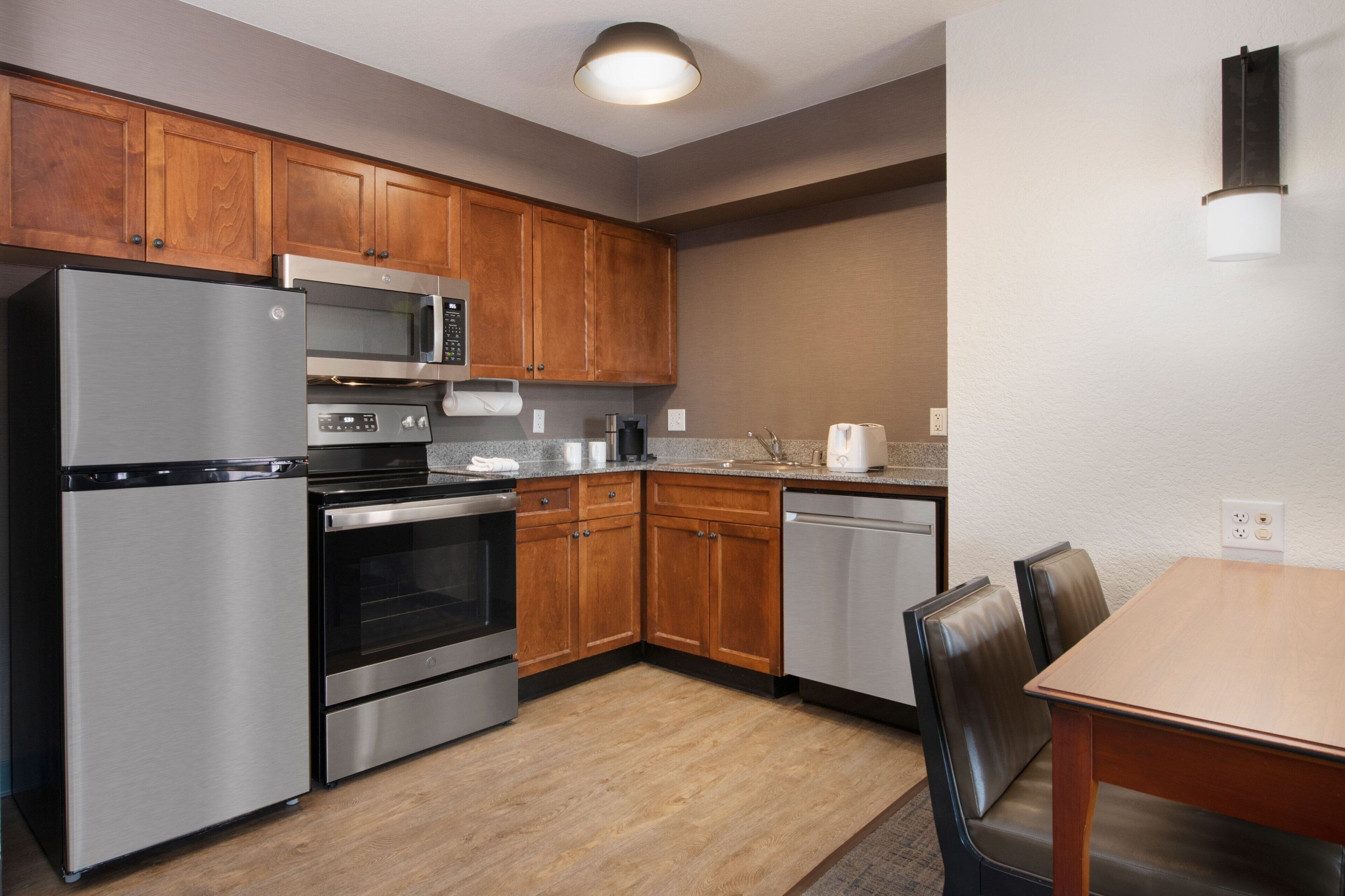 full-sized fridge, microwave, stovetop, dishwasher