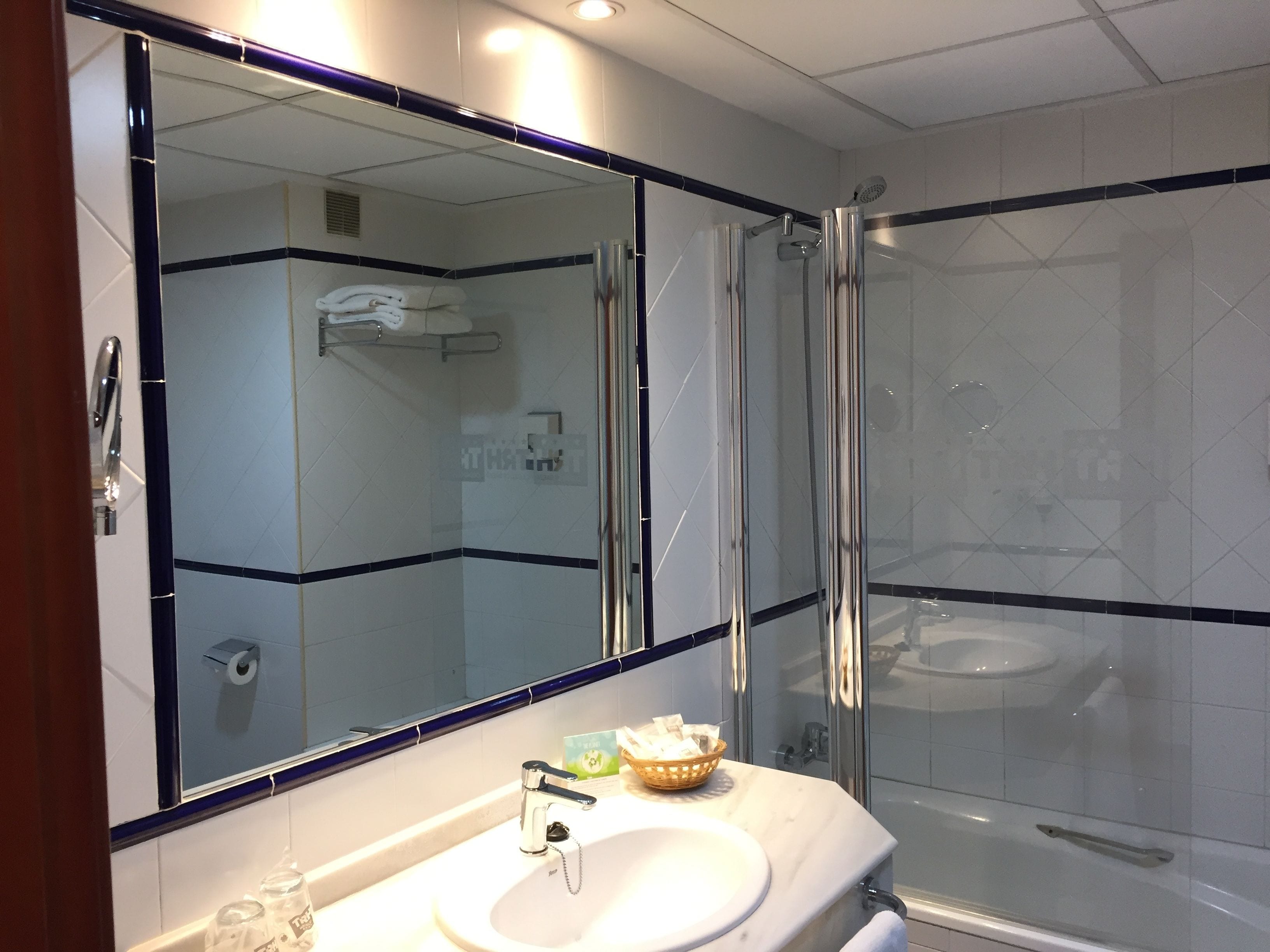 designer toiletries, hair dryer, bidet, towels