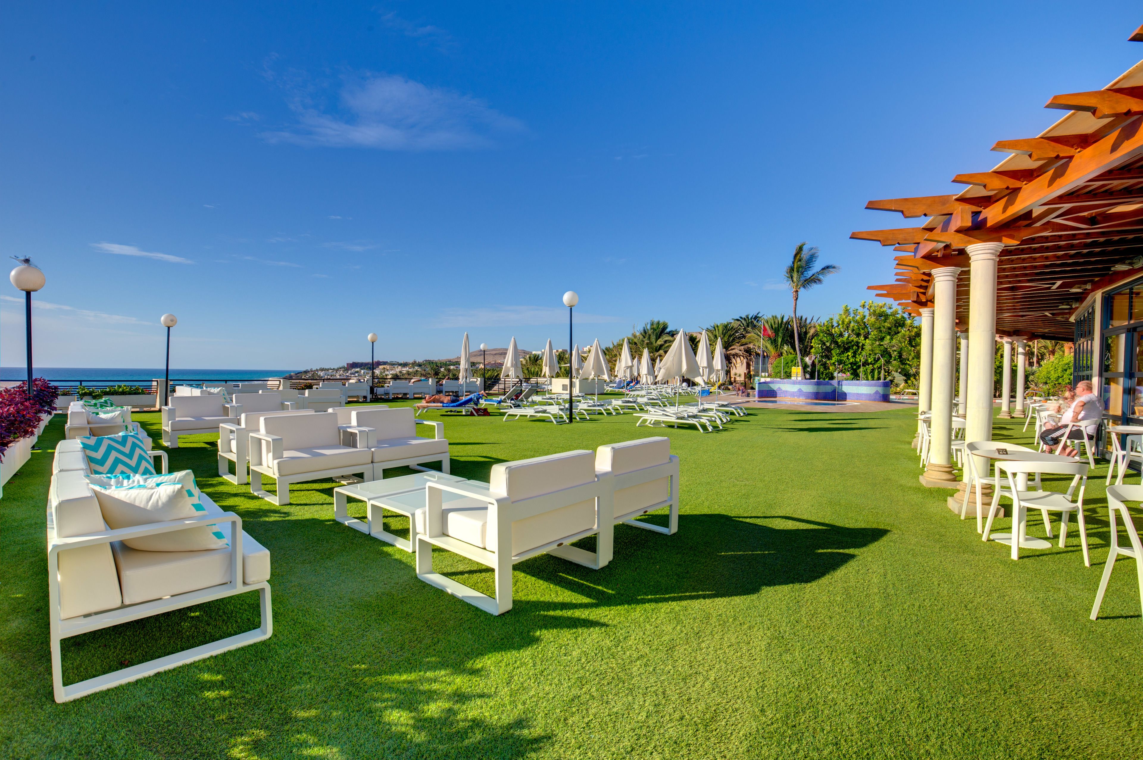 Outdoor pool, a lap pool, pool umbrellas, pool loungers