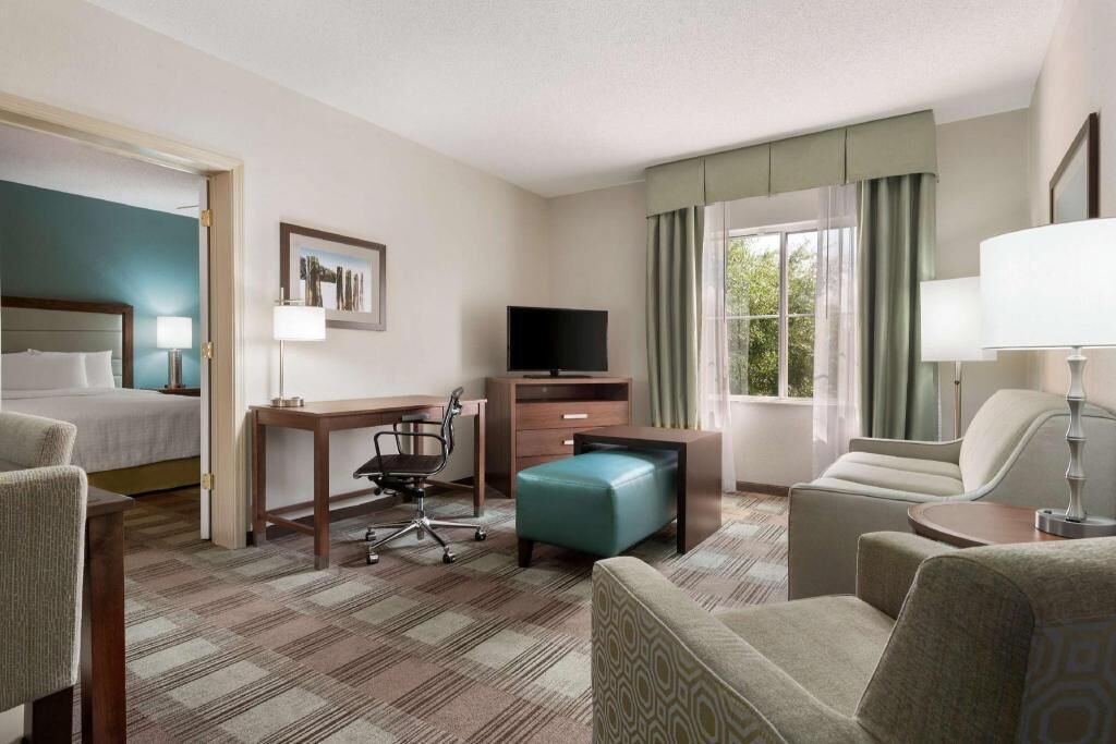 Premium bedding, desk, laptop workspace, blackout drapes
