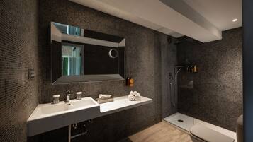 Shower, designer toiletries, hair dryer, bathrobes