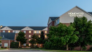 A hotel with a sign reading "Homewood Suites by Hilton." It features a brick facade with multiple windows and a flat roof. - Homewood Suites by Hilton Detroit-Troy (Troy)