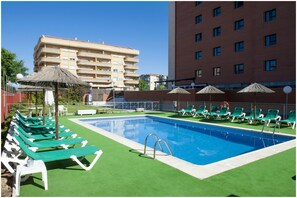 Seasonal outdoor pool, open 11 AM to 8:30 PM, pool umbrellas
