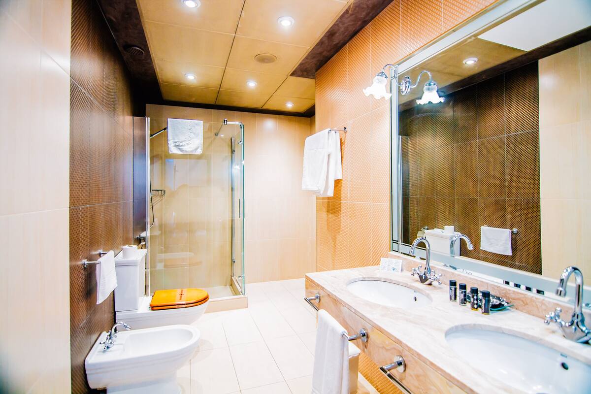 royal suite, 2 bedrooms, jetted tub, sea view | 1 bedroom, desk, blackout curtains, iron/ironing board