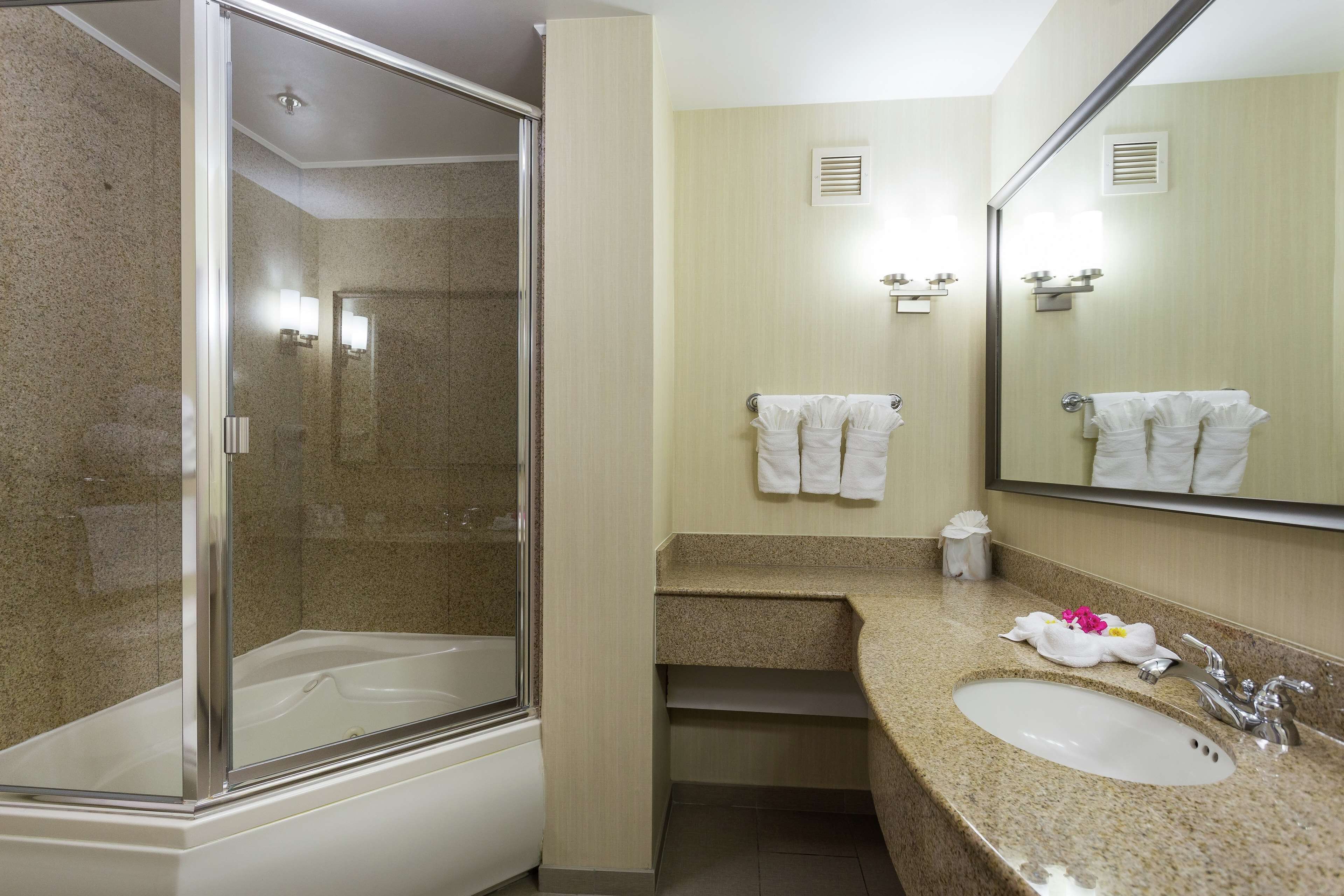 combined shower/bathtub, hair dryer, bathrobes, towels