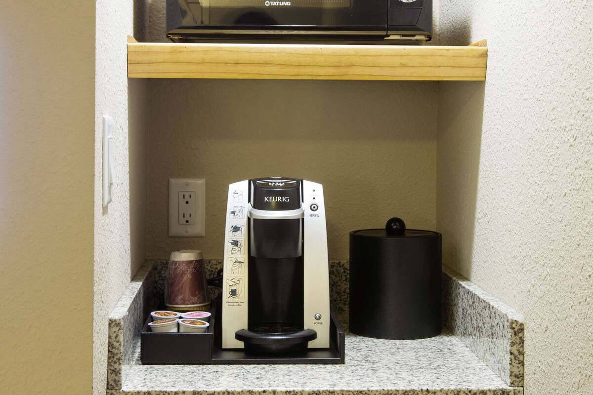 desk, blackout curtains, iron/ironing board, cots/infant beds