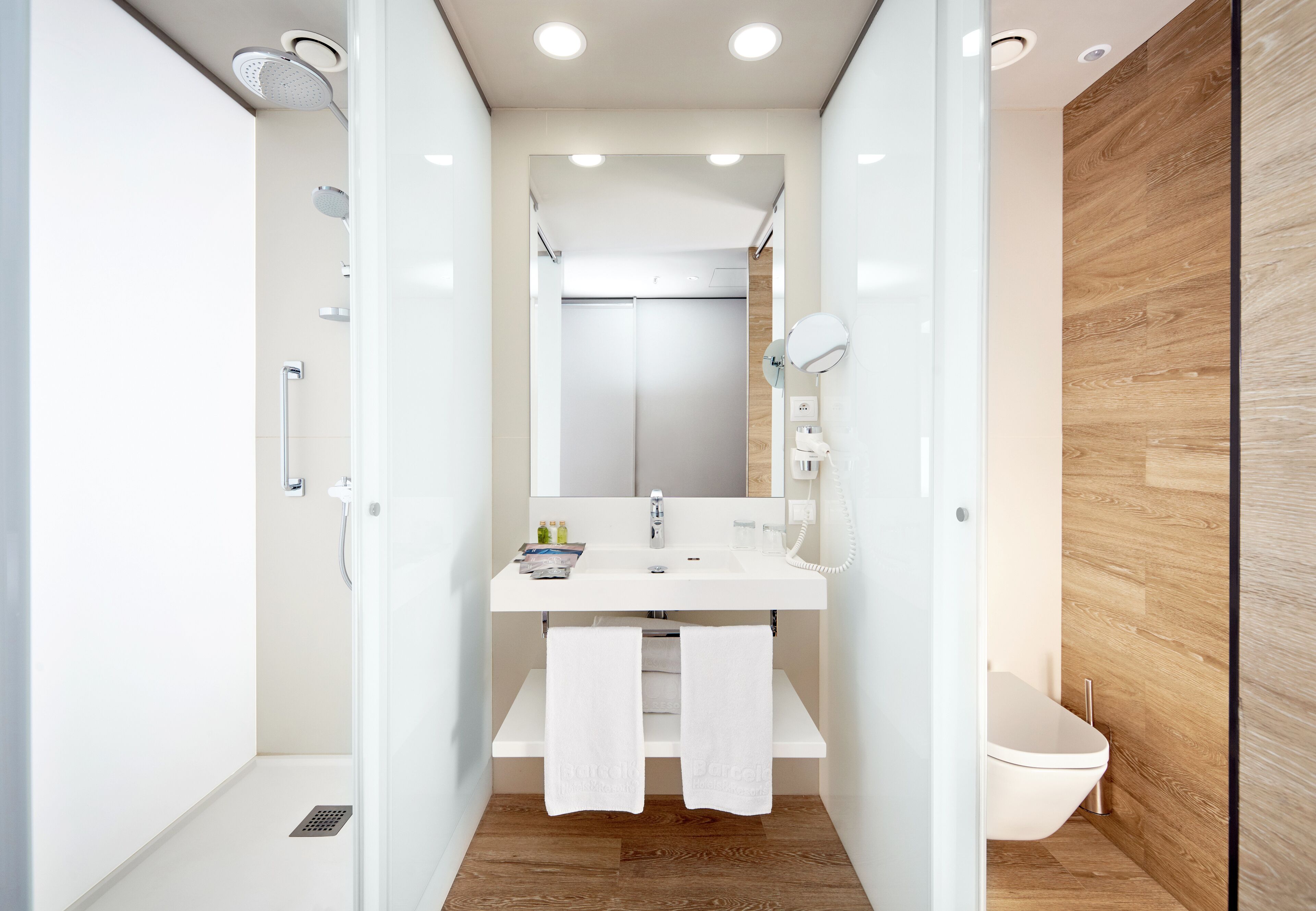 rainfall showerhead, eco-friendly toiletries, hair dryer, towels