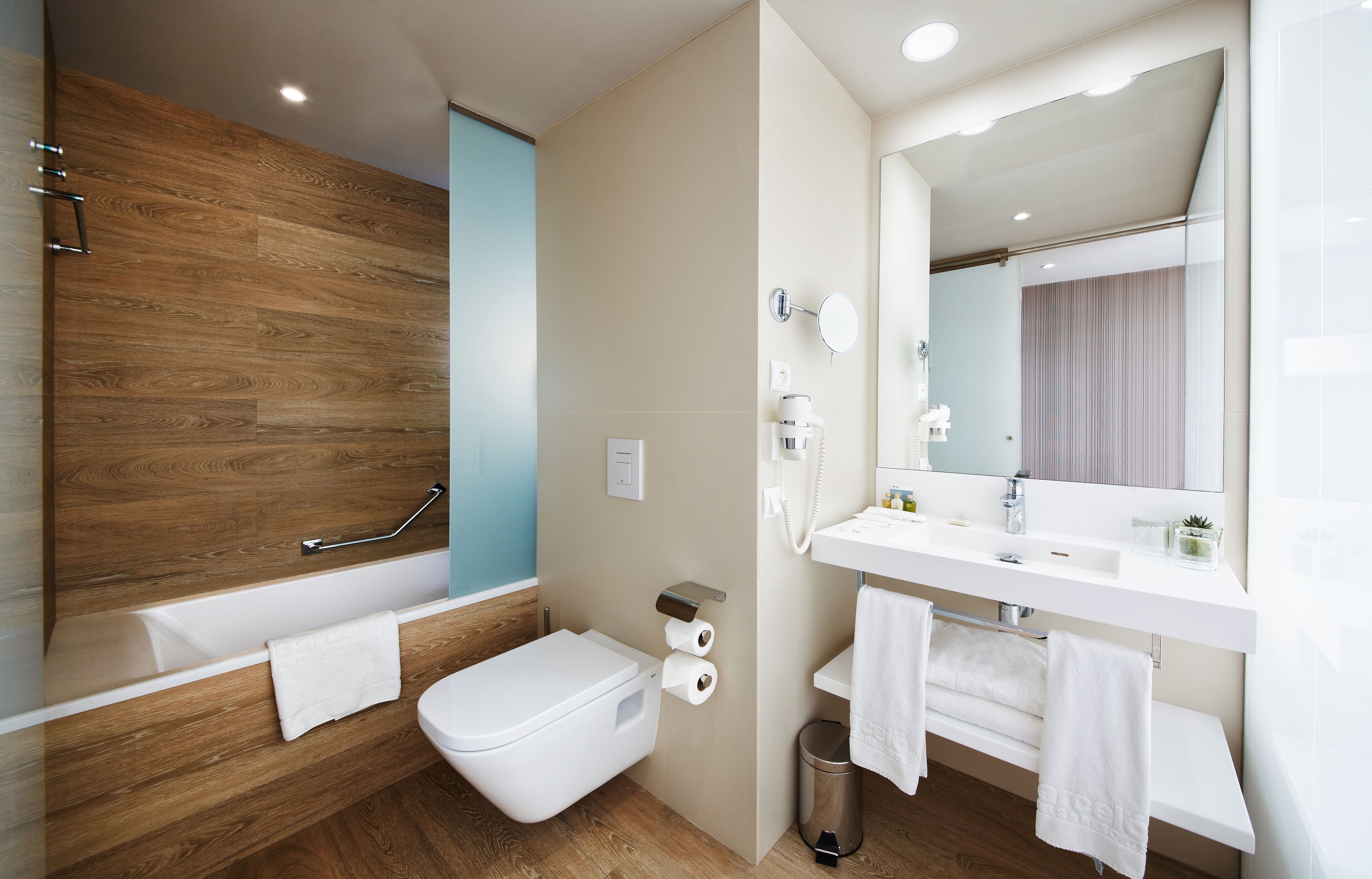 rainfall showerhead, eco-friendly toiletries, hair dryer, towels