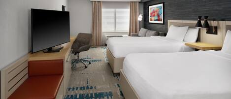 A hotel room with two beds, a television, a desk with a chair, a window with curtains, and a painting on the wall.