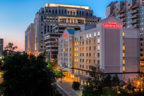 A multi-story hotel with a prominent 'Hilton Garden Inn' sign, featuring a modern architectural design with large windows and a flat roof. - Hilton Garden Inn Arlington/Courthouse Plaza (Arlington)